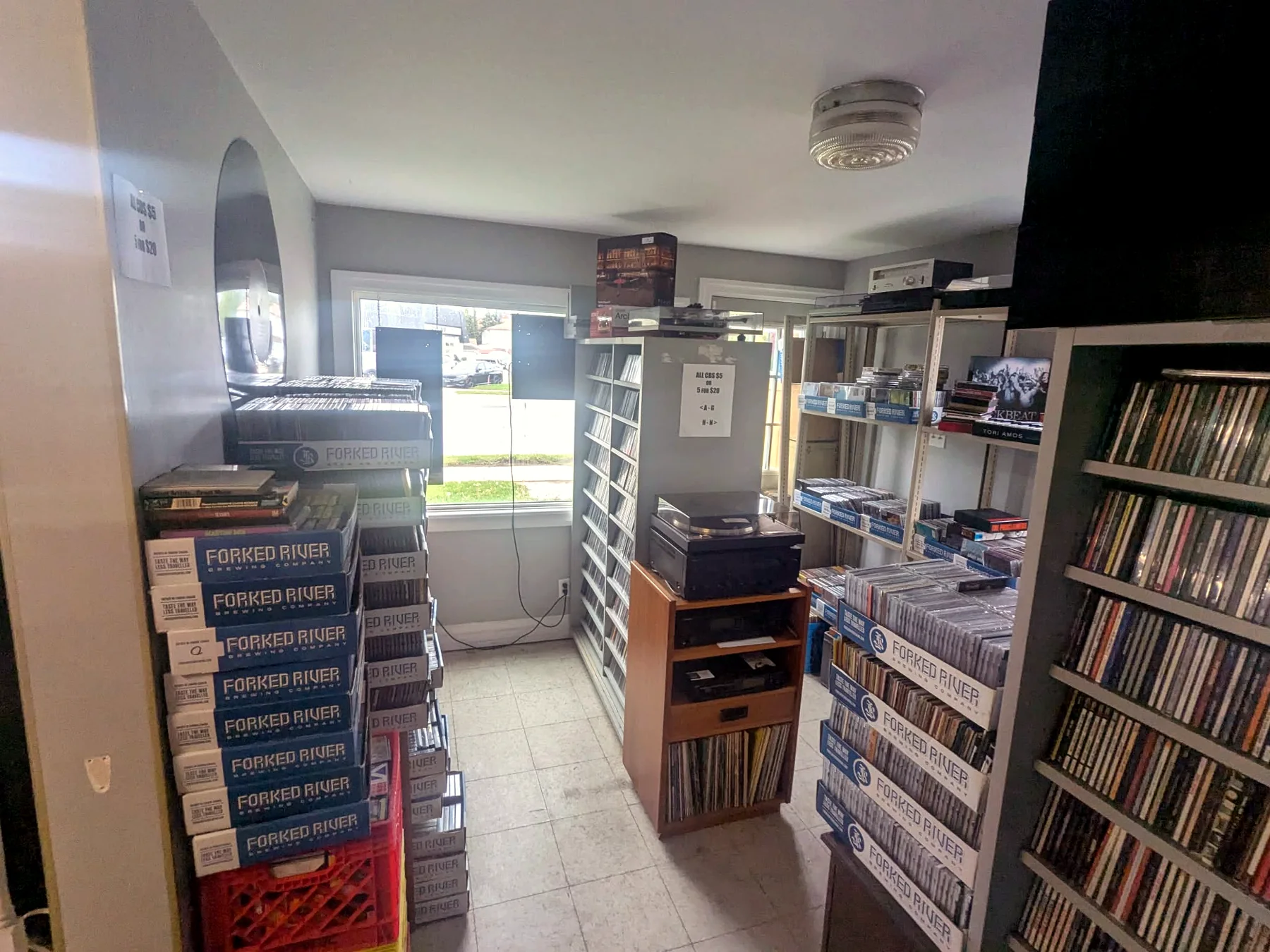 Front room CD shelves and boxes at Speed City Records