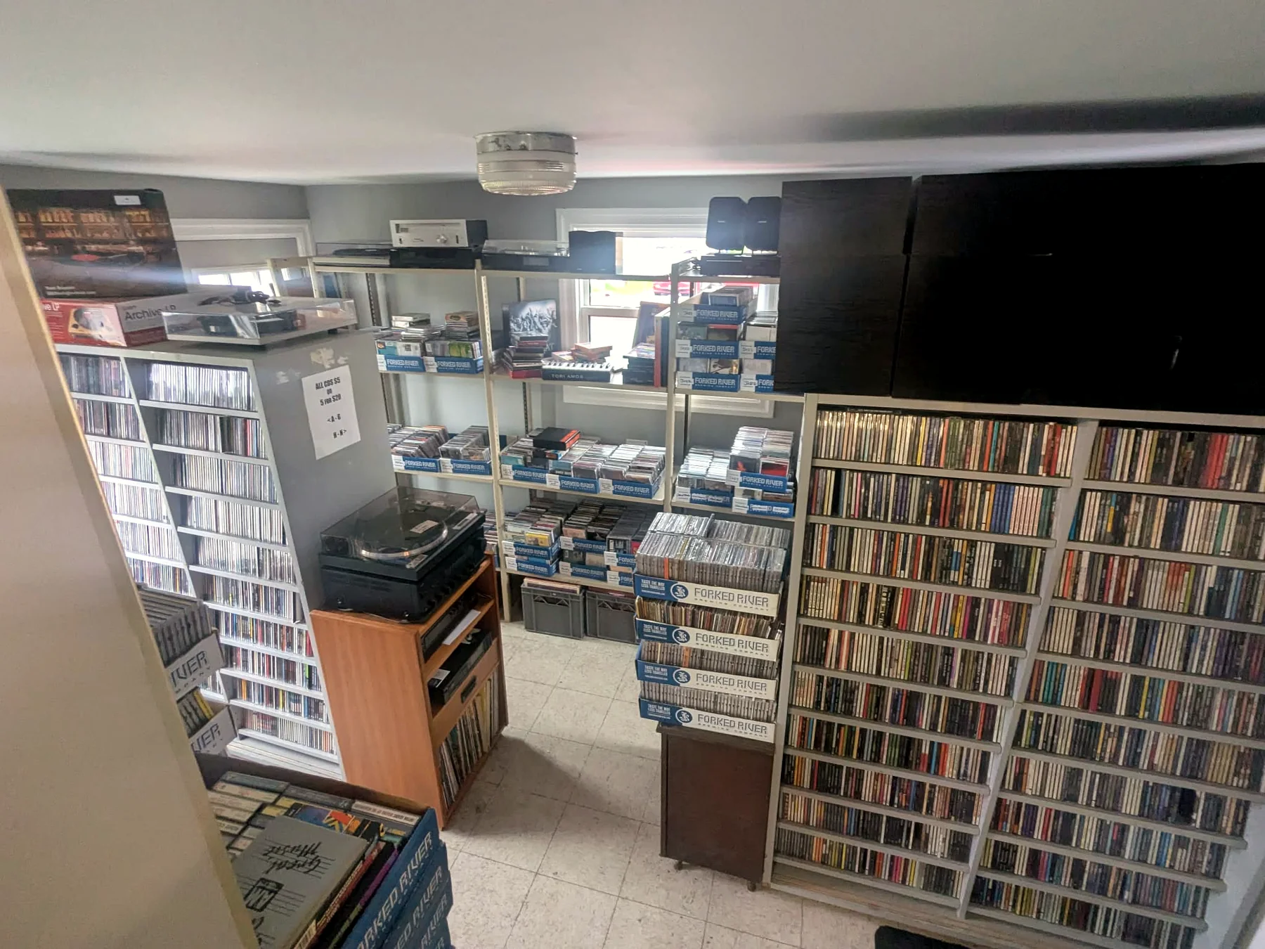 Wall shelves of used CDs at Speed City Records