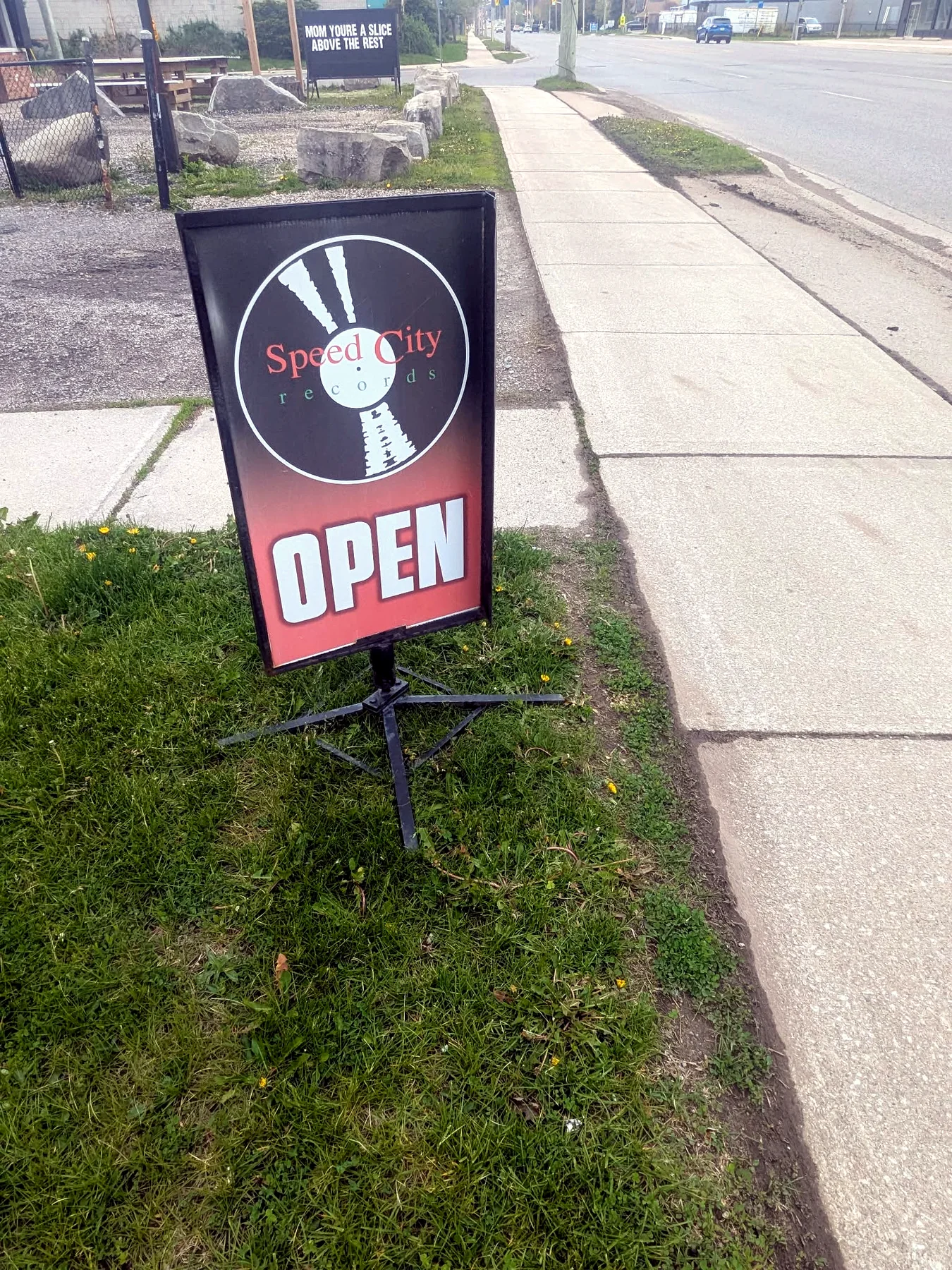 Speed City Records open sign on Springbank Drive